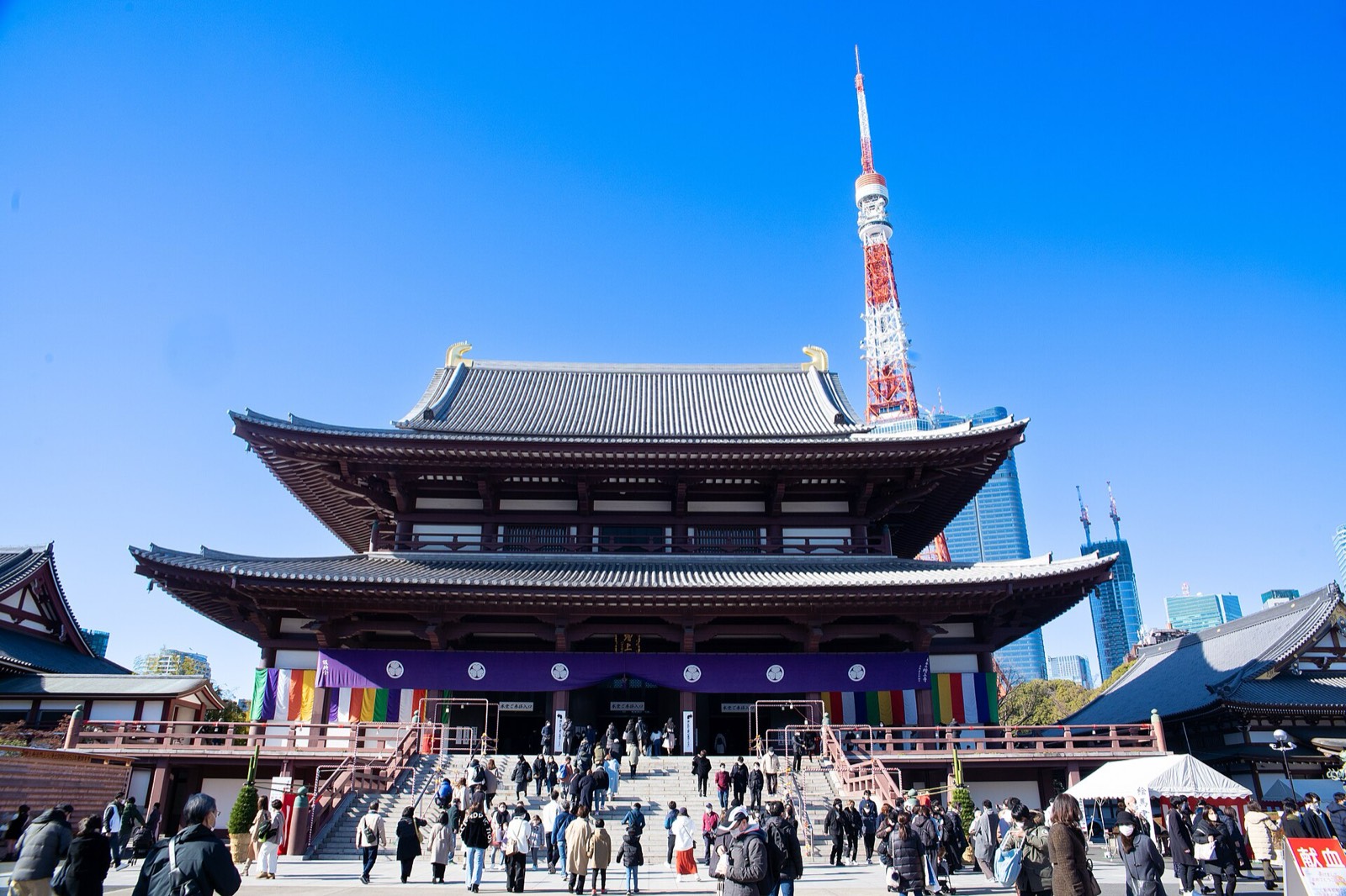 A view of Zojoji's main hall with Tokyo Tower rising behind it